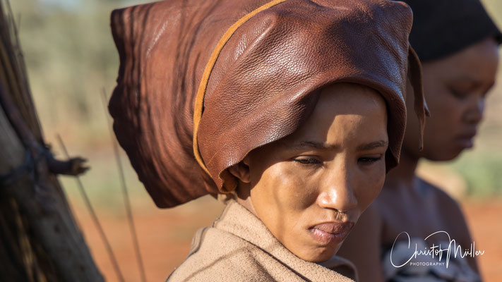 The shy look of this Khoisan woman shows the uneasy feeling of being exposed in some way.