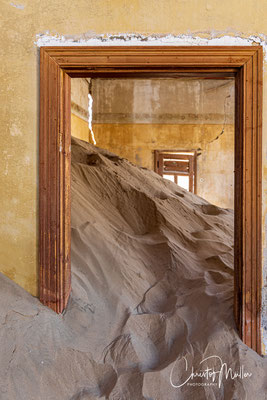 The sand dunes make their way inside the buidings in Kolmanskop