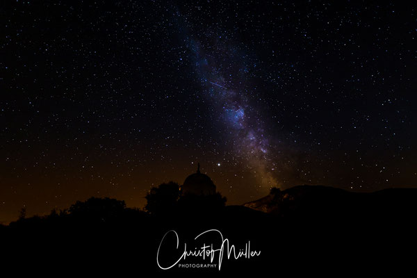 The Milky Way above  a large white domed mausoleum at Palasca Corsica, France