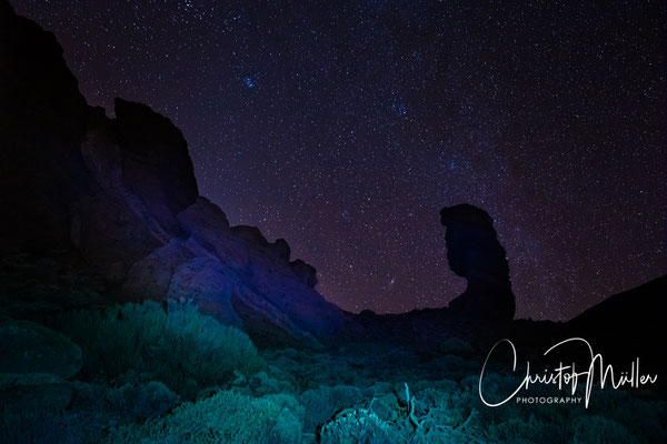 Starry night above the iconic Roque Cinchado in Tenerife, Spain in Teide National Park.