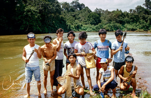 a group portrait of my hosts and friends after fishing successfully in the Batang Ai River