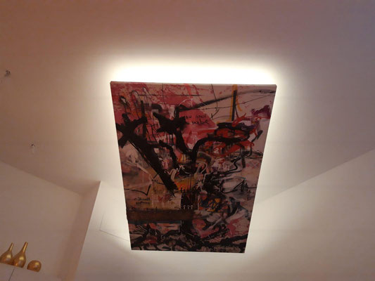 This buyer found a new way of displaying this large scale paintings. She had it installed on the ceiling with lightning around it.