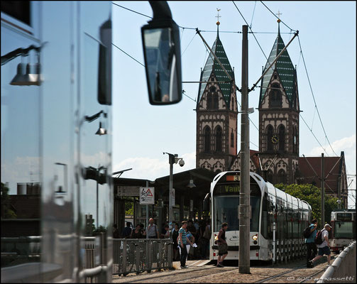 The tram and pedestrian bridge over the rail station