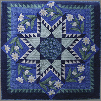 Wall quilt with hand applique