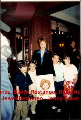 The cast celebrates as Reba gets her characature on the wall at the NYC restaurant Sardi's. May 23rd 2001