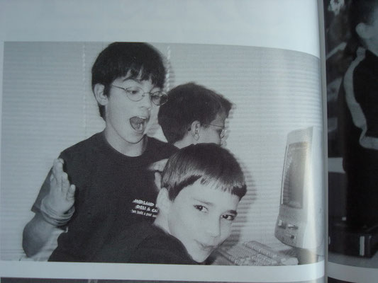 Joe doing something weird with a couple of friends and the ol' computers we all remember and hate. ECMS. Grade 6, 2002.