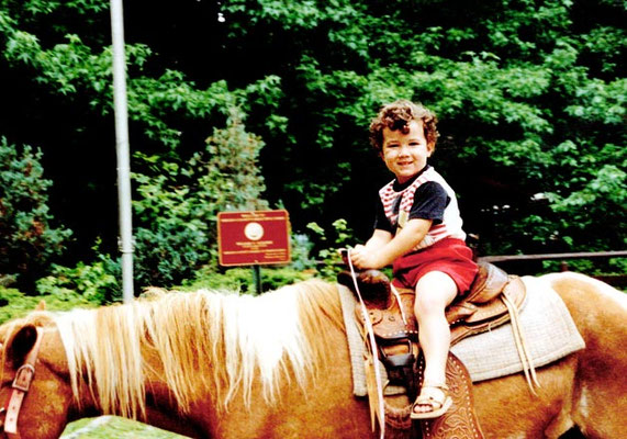 3 year old Kevin riding a horse.