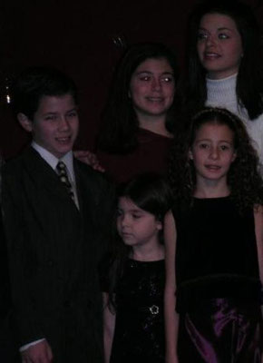 Nick with 'The Sound of Music' kids (only Caroline London, Krista Pioppi, Tiffany Giardina, and Elizabeth Lundberg shown). December, 2003 at a Benefit Holiday Concert for the Paper Mill Playhouse in New Jersey