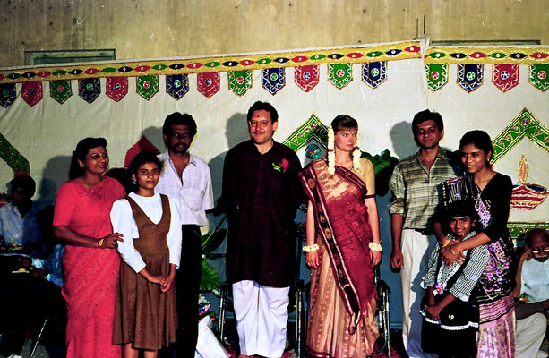 The newly wed couple posing with well-wishers during a reception at Rashtriyashala Ashram, Rajkot, Gujarat, 1994.