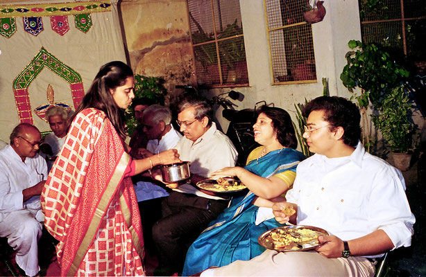 Sarojbehn Goda serves Siddharth Gondhia and his parents during the reception at Rashtriyashala Ashram, Rajkot, Gujarat, 1994.