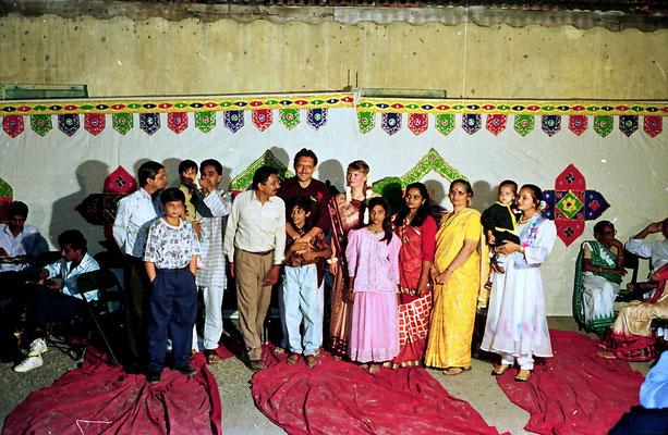 The newly wed couple posing with well-wishers during a reception at Rashtriyashala Ashram, Rajkot, Gujarat, 1994.