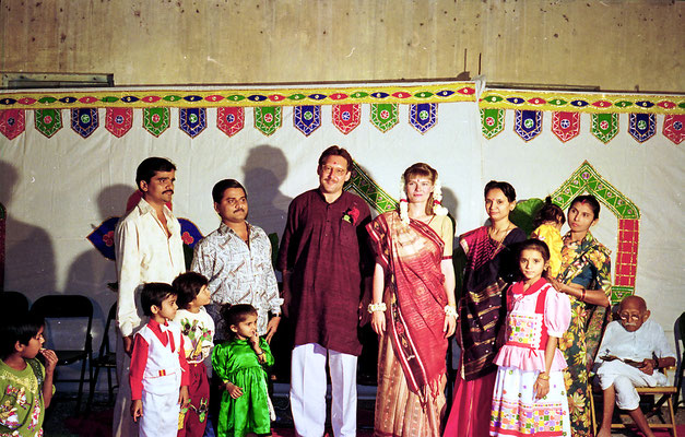 The newly wed couple posing with well-wishers during a reception at Rashtriyashala Ashram, Rajkot, Gujarat, 1994.