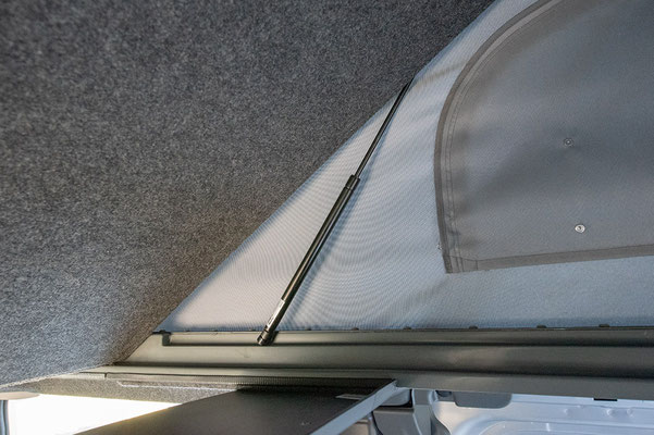 Upper bed in Trafic campervan roof, gas strut operated