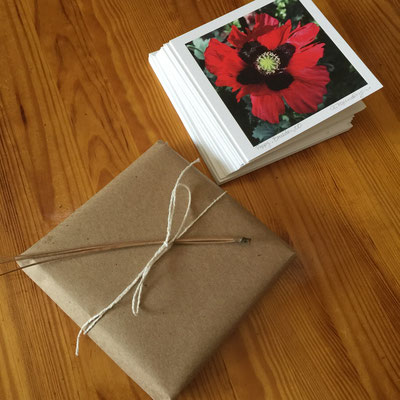 Sets of 10 different photo cards with matching envelopes are packaged with eco-kraft paper tied with string