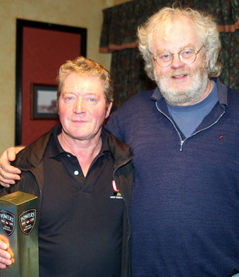 Dee Byrne who won a bottle of whiskey at the Perth Celtic Supporters club raffle during the Champions League match between Villareal & Celtic in Sharkey's bar Annagry also in the photo is Harald Juengst who organised the raffle (Photo John Rafferty Photog