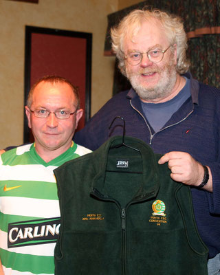 Josie Joe receives his Perth Celtic Supporters club jacket which he won in the raffle during the Champions League match between Villareal & Celtic in Sharkey's bar Annagry also in the photo is Harald Juengst who organised the raffle (Photo John Rafferty P