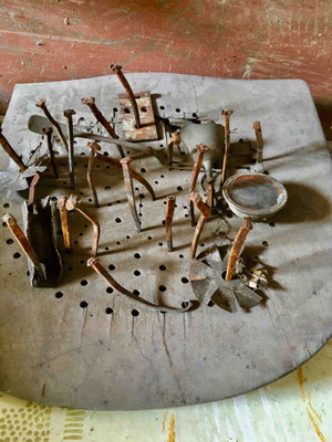 Action: The seat of an old chair got spiked with old handcrafted nails