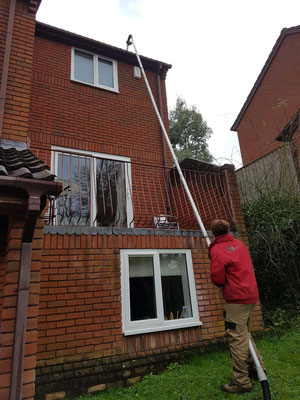 Vac system in use to clear the guttering on this 3 storey house in Exeter