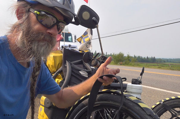 CA. Solatrike with flat tire entering Prince George