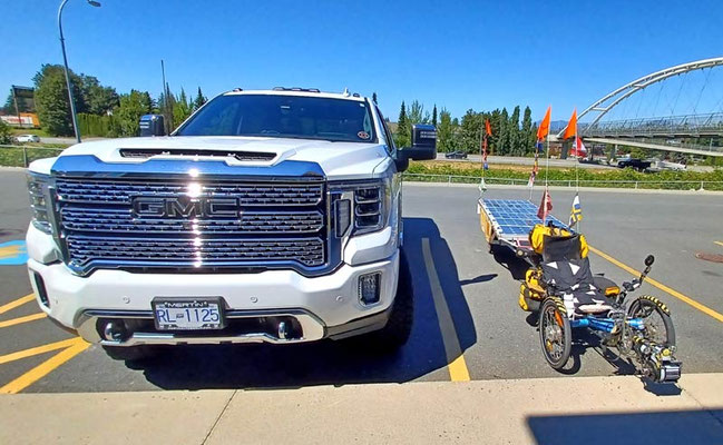 CA.Solatrike in Abbotsford beside an SUV-Truck