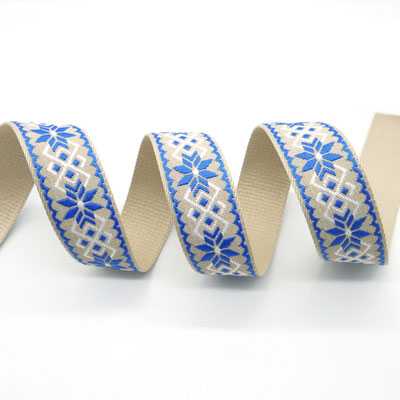 Beiges Gurtband mit Edelweiß‑Stickerei in Blau, ca. 38–40 mm breit