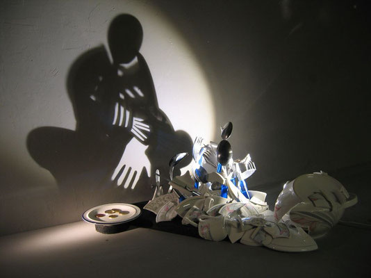 Shattered. About rich and poor. Shadow sculpture