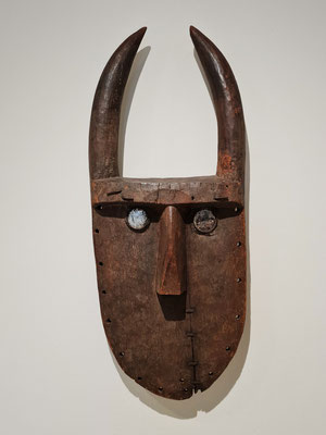 Unrecorded Toma or Loma artist, Guinea. Mask. Probably first half of 20th century. Wood, iron nails, glass, metall, and rasin.