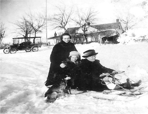 1922: Hazel, Violet and Mary Johnson sledding with Poly (dog) (Last photo of Mary Johnson before her death)