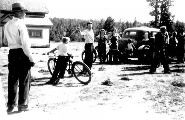 Bike racer at finish line with the school in the background