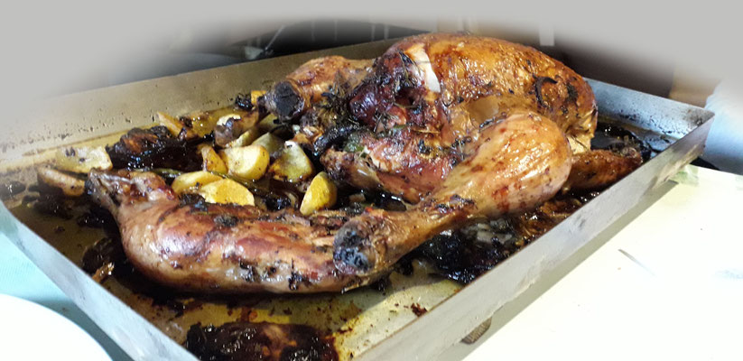 Pollo asado en horno de leña.