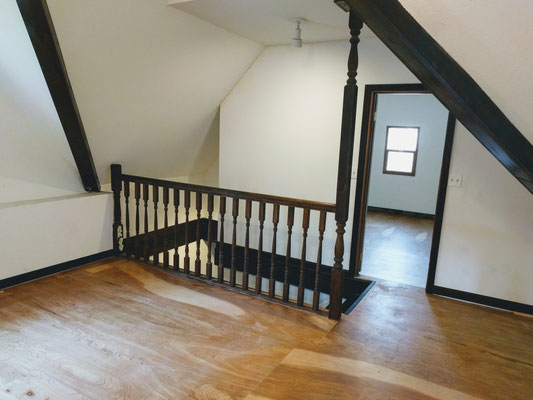 Upstairs living room, looking at stairwell and bedroom