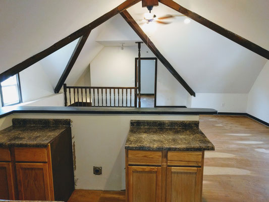Inside upstairs kitchen at, looking at living room