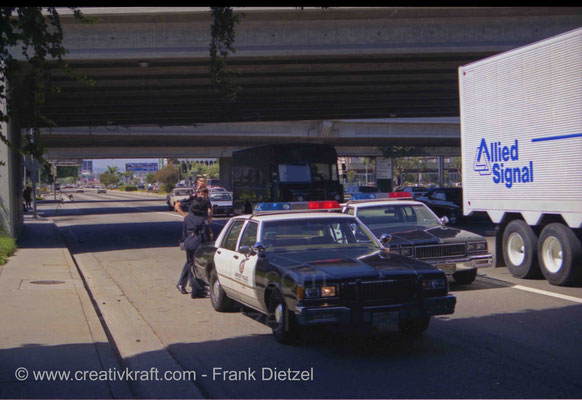 LAX Los Angeles Airport Police cars (No. C 2502 front left) Chevrolet Caprice Classic 1988, AlliedSignal (Honeywell) truck, S Sepulveda Blvd under Worldway bridges