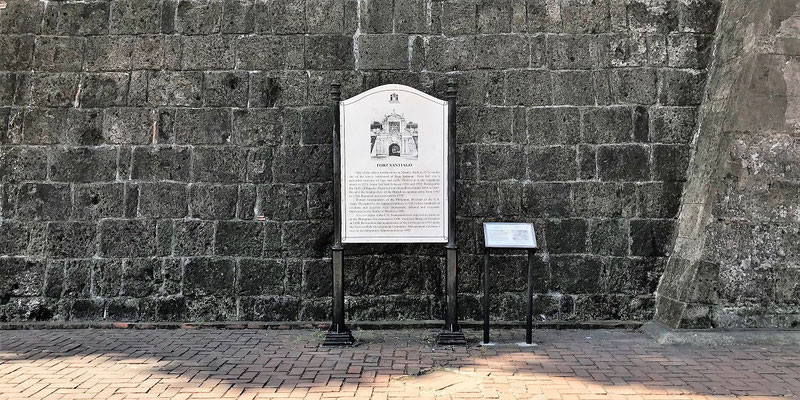 Wall of the Fort Santiago’s Arch and a Marker