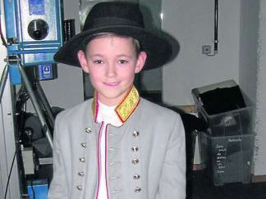 Bremen 2012, 9 year old Dennis Böse backstage super stylish in stage father Kaiser Franz Josef's hat.