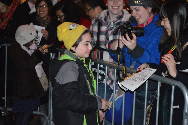 March 2014, the kids signing some autographs after a preview.