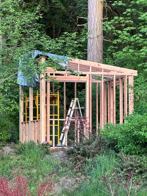 April 30, 2025. Exterior view of the studio with sloped side walls in place.