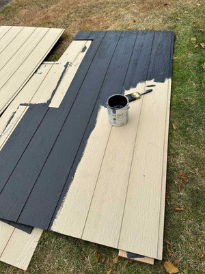 July 31, 2025. One of the LP Smart Siding panels being painted after being cut to fit around a window.