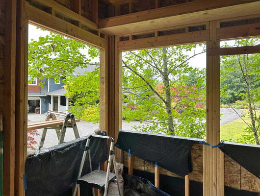 June 22, 2025. Now it's starting to resemble a little house. Note the display shelf above the windows.
