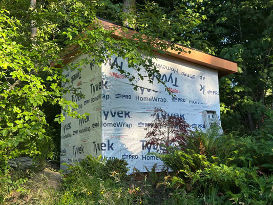 June 30, 2025. Wrapped the entire structure with Tyvek moisture barrier, prior to installing the final exterior siding panels.