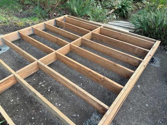 March 30, 2025. With floor joists completed, a second rim-joist was added to the bracket sides, and blocking was added down the center for rigidity.