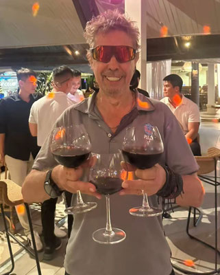 Rainbow Divers Vietnam PADI Career Development Center Jeremy P Stein Course Director Portrait with wine glasses