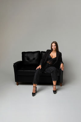 Confident woman photographed with intentional light and guided posing