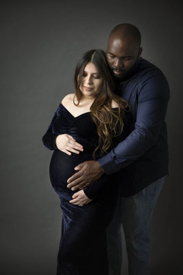 Fine art maternity photography emphasizing curves and strength