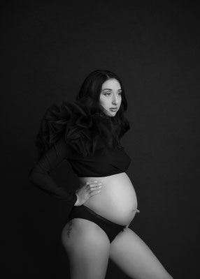 Bold maternity portrait created in a private studio environment