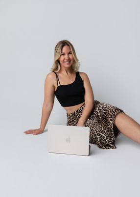 Professional business portrait of a confident woman in a minimalist studio