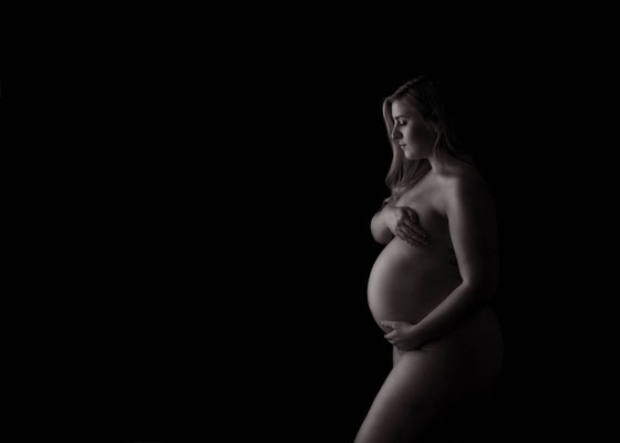 Artistic maternity silhouette portrait in a private studio
