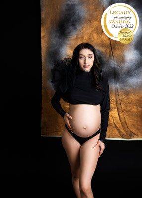 Timeless maternity portrait created in a luxury studio