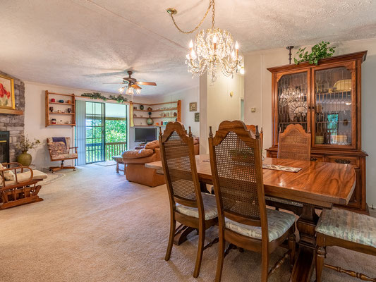 Dining room with living room in background