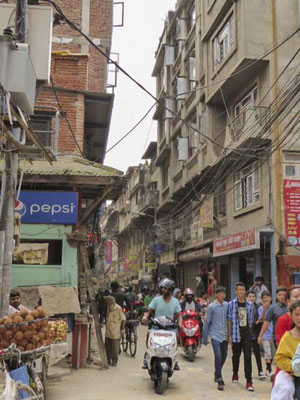 Everyone squeezes into the small streets of the city. 